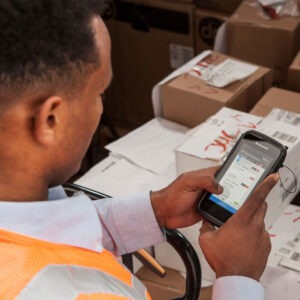 Warehouse worker scanning packages