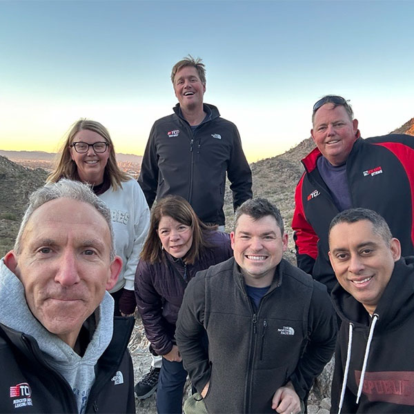 TCI Leadership team on mountain summit