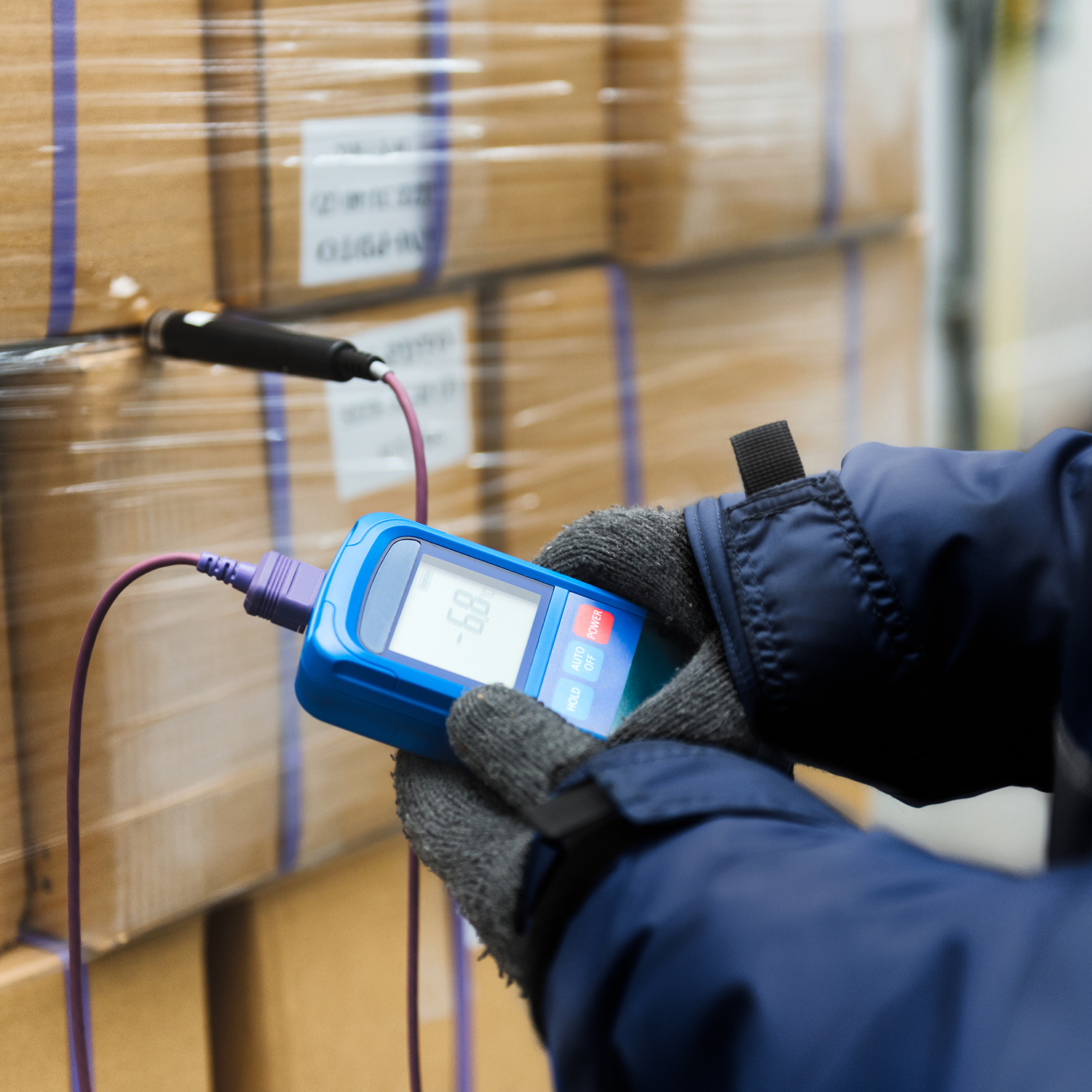 Checking temperatures in a cold storage warehouse