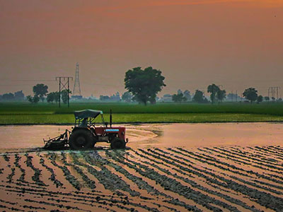 Tractor on farm in the distance