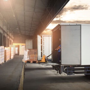 Trucks Parked Loading at Dock Warehouse.